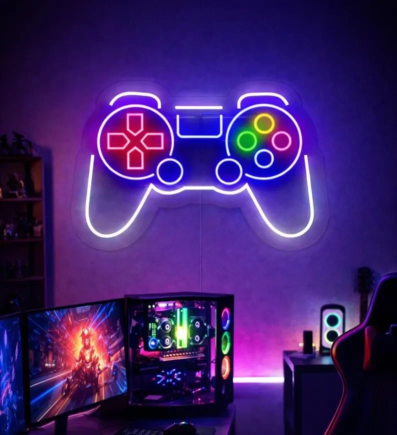 Neon gamepad sign above a gaming desk